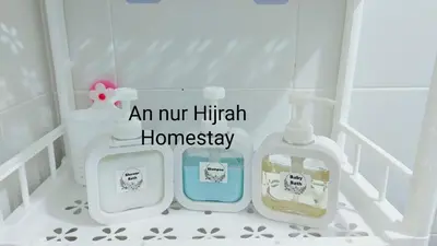 a bathroom with two bottles of detergents in a crib at Homestay Annur Hijrah Seri Iskandar Near UiTM ,UTP in Seri Iskandar