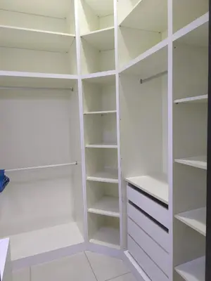 a white walk in closet with white shelves at RoomB w attached bathroom w bathtub in George Town