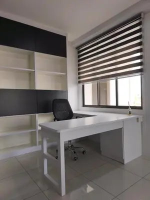 a white desk with a chair and a window at RoomB w attached bathroom w bathtub in George Town