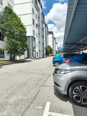 two cars parked on a street next to a building at HS homestay Casa Klebang Ipoh in Ipoh