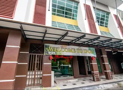 a building with a welcome to sign on it at King's Lane in Ipoh