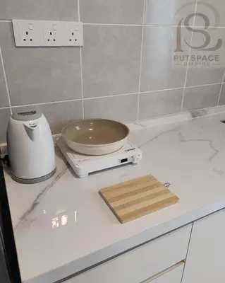 a kitchen counter with a bowl on a scale on it at Putspace Empire-Bandar Baru Putra, Ipoh Perak in Ipoh