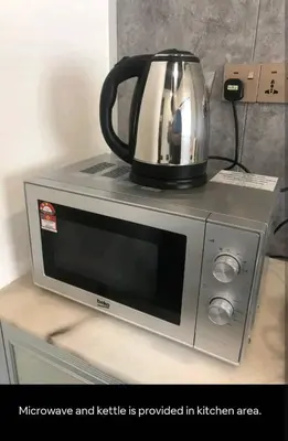 a tea kettle sitting on top of a microwave at Bukit Mertajam 1 pax Salesman 5pm to 8am Room in Bukit Mertajam