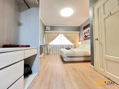 a bedroom with a bed and a window at Kelip2 Hill View Cameron 5 min to Kea Farm in Brinchang