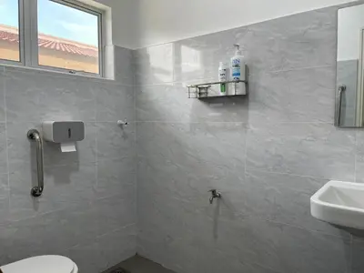 a bathroom with a toilet and a sink at Free EV Car Charge KTV Snooker&PS5Game 13Pax Ipoh in Ipoh