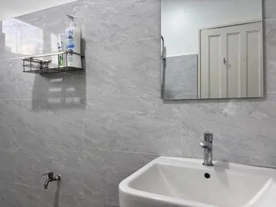 a bathroom with a sink and a mirror at Free EV Car Charge KTV Snooker&PS5Game 13Pax Ipoh in Ipoh