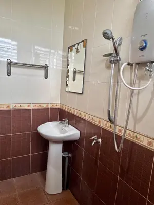 a bathroom with a sink and a shower at Villa Desa Permai in Sungai Besar