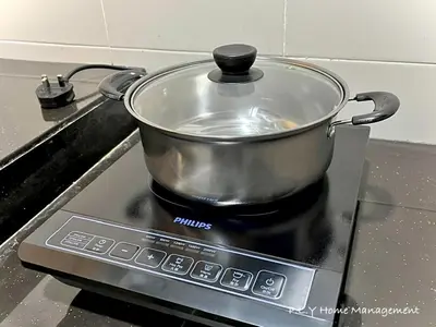 a pot sitting on top of a stove at Kampung Paloh Residence Ipoh Town in Ipoh