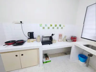 a kitchen with a counter top with a sink at Ipoh Tambun Field - Landed House 9px - 3R2B in Ipoh
