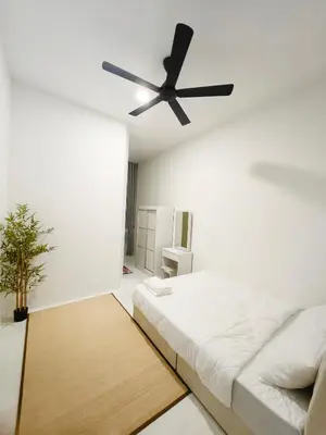a white room with a bed and a ceiling fan at Private Roomstay Shared Home Near KTM Batu Gajah in Batu Gajah