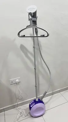 a lamp sitting on the floor next to a wall at Hatasan Homestay Guess House