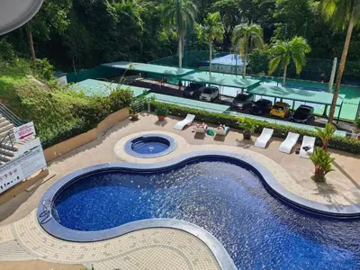 an overhead view of a swimming pool at a resort at Batu Ferringhi Sri Sayang Resort in Batu Ferringhi