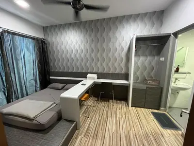 a small bedroom with a bed and a desk at Majestic Condo Top Floor 2room Smart TV & WiFi in Ipoh
