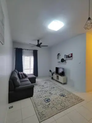 a living room with a couch and a ceiling fan at HS Homestay Casa Klebang Ipoh in Chemor