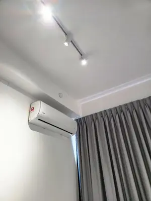 a room with a ceiling fan and a curtain at Spacious 3BR Seaview Home 10pax a29 in George Town