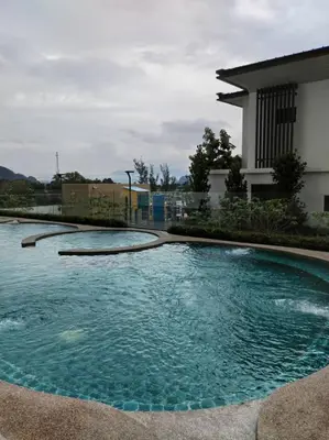 a large pool of water in front of a house at Sunway Onsen superb view 4-6 pax in Tambun