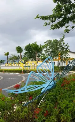 a blue metal bench in front of a roller coaster at Alaa De Amansara Homestay in Kepala Batas