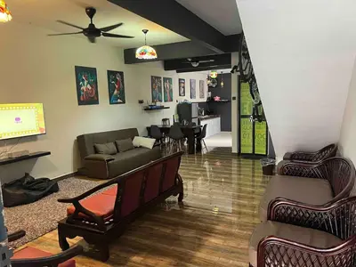 a living room with a couch and a table at Ipoh Menglembu M35 Smart TV & Wifi ready in Ipoh