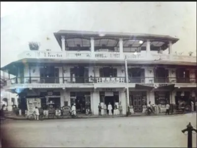 a building with people standing in front of it at Loke Thye Kee Heritage Hotel in George Town