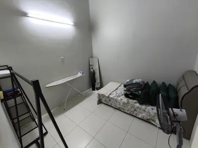 a small room with a bed and a ladder at Homestay Rumah Iman in Kamunting