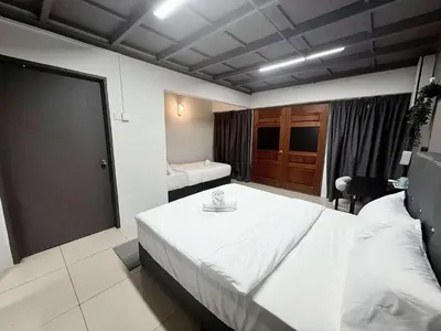 a bedroom with a large white bed in a room at Gather inn in George Town