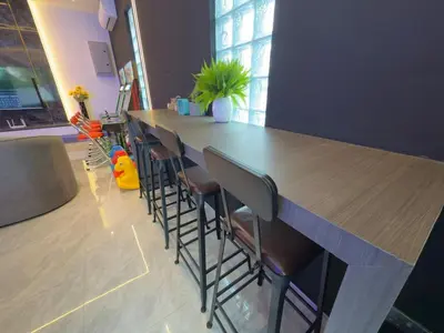 a long bar with stools in a room at LYL 108 Private Pool Villa in Ipoh