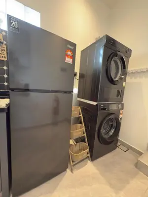 a refrigerator and a washing machine in a room at LYL 108 Private Pool Villa in Ipoh
