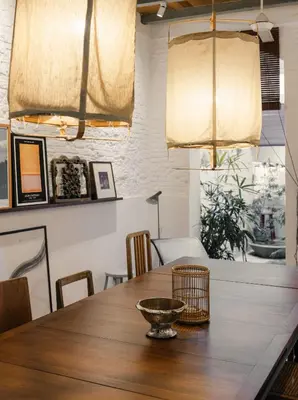 a dining room with a wooden table and chairs at Cheong Fatt Tze - The Townhouses in George Town