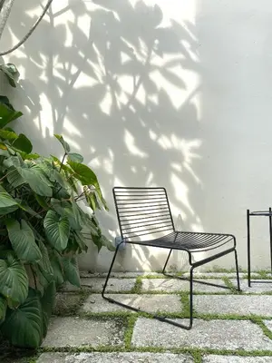 a chair sitting in front of a wall at Cheong Fatt Tze - The Townhouses in George Town