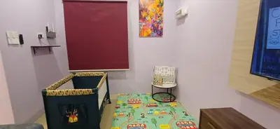a table in a room with a table with at Lavender Splash Homestay in Ipoh