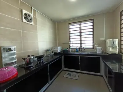 a kitchen with a sink and a counter top at Lahat Serenity 168 Big Corner Cozy House in Lahat
