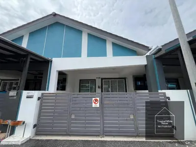 a blue and white house with a gate at Zafirah Ipoh Homestay Musllim Only in Ipoh