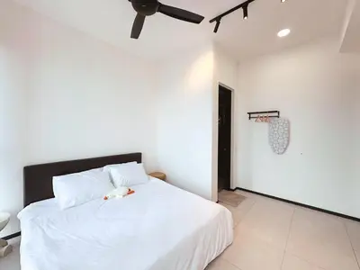 a bedroom with a white bed and a basketball hoop at Urban Seaview, City view, New 3BR 6pax, Jelutong in George Town