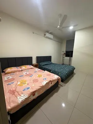 a bedroom with two beds in a room at 96 HomeStay Sungai Besar in Sungai Besar