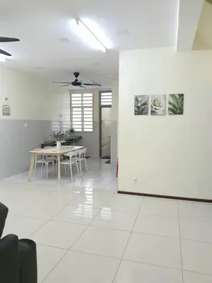 a white living room with a table and a ceiling at Homestay Bajet EM3 Pantai Damai 2 in Pantai Remis