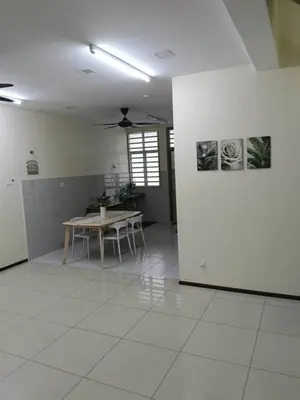 a living room with a table and a dining room at Homestay Bajet EM3 Pantai Damai 2 in Pantai Remis