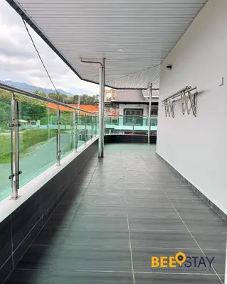 a balcony with a view of a tennis court at Taiping City Centre Landed Corner Lot for 12 Pax in Taiping