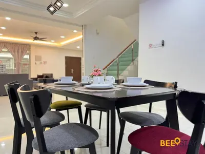 a dining room with a table and chairs at Taiping City Centre Landed Corner Lot for 12 Pax in Taiping