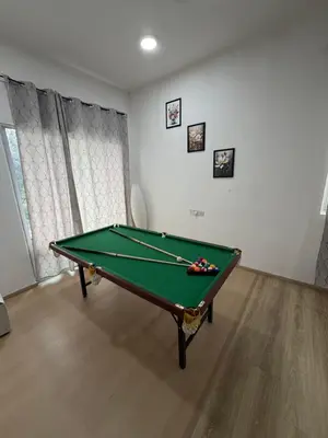 a room with a pool table in a room at AYAAN ATRIUM Homestay with PS4 GAMING and Snookers in Tanah Rata