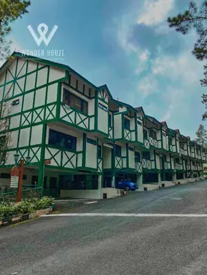 a large building with a sign on the side of it at Cozy Highlands Escape at Copthorne Cameron Highlands in Tanah Rata