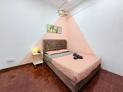 a small bedroom with a bed in a attic at CozyKota8Pax 4MinsToJonker in Gua Sai