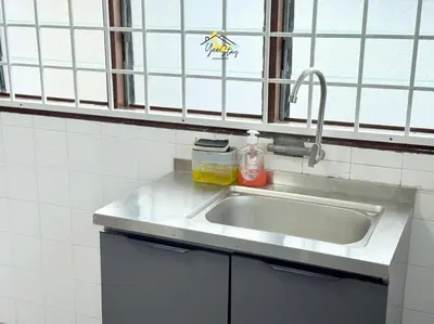 a kitchen counter with a sink and a window at CozyKota8Pax 4MinsToJonker in Gua Sai