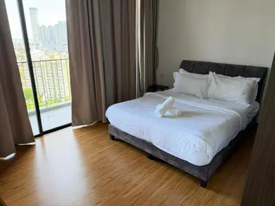a bed in a room with a large window at Beacon Executive Suites with Infinity Pool by BNB4U in George Town