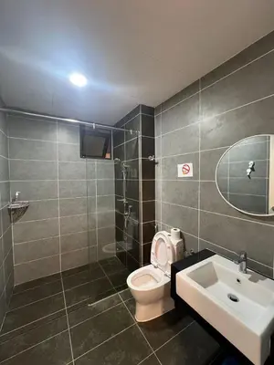 a bathroom with a toilet and a sink at 2Br Sunway Onsen Suit 5 Pax in Tambun