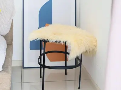 a stool with a furry seat and a chair with a table at 2Br Sunway Onsen Suit 5 Pax in Tambun