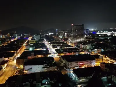 a view of a city at night with lights at Homii Ipoh CBD in Ipoh
