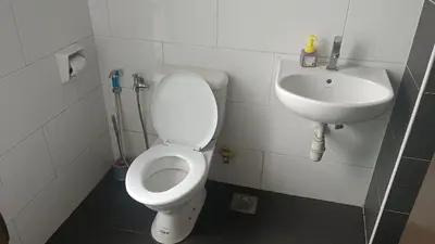 a bathroom with a toilet and a sink at Skyhauz Ipoh Cityview 2BR Homestay in Ipoh