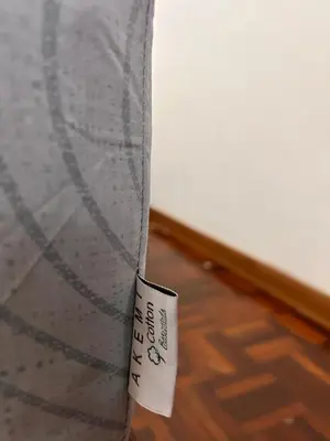 a close up of a mattress with a tag on it at Comfortable two-storey terrace house near main road perai in Perai