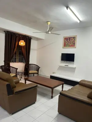 a living room with a couch and a table at Comfortable two-storey terrace house near main road perai in Perai
