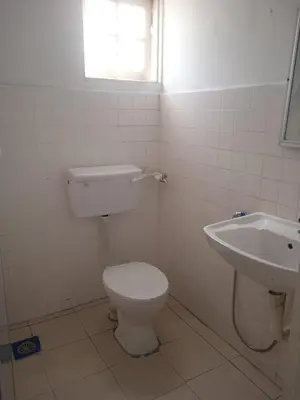 a bathroom with a toilet and a sink at Netasha Holiday INN in Tanah Rata